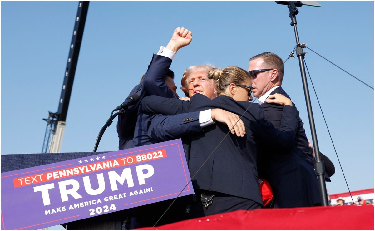 Donald Trump es protegido por el Servicio Secreto luego que intentaron atentar contra su vida. Foto: Anna Moneymaker/AP